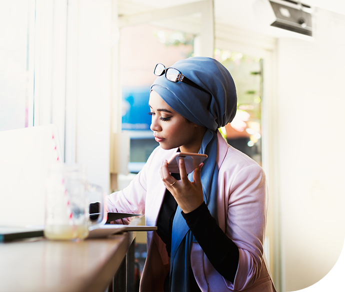 woman in hijab talking on phone